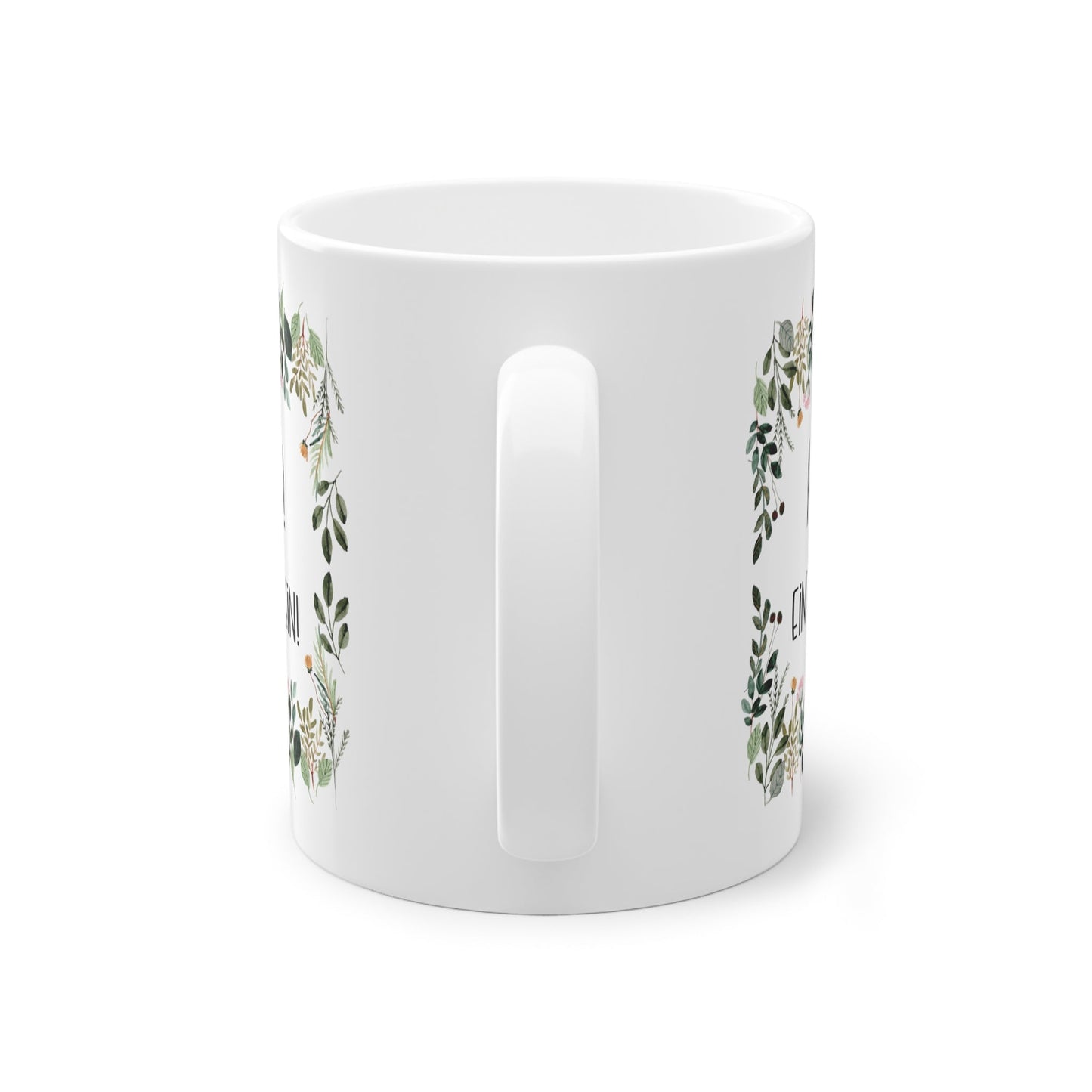 a white coffee mug with a floral design on it