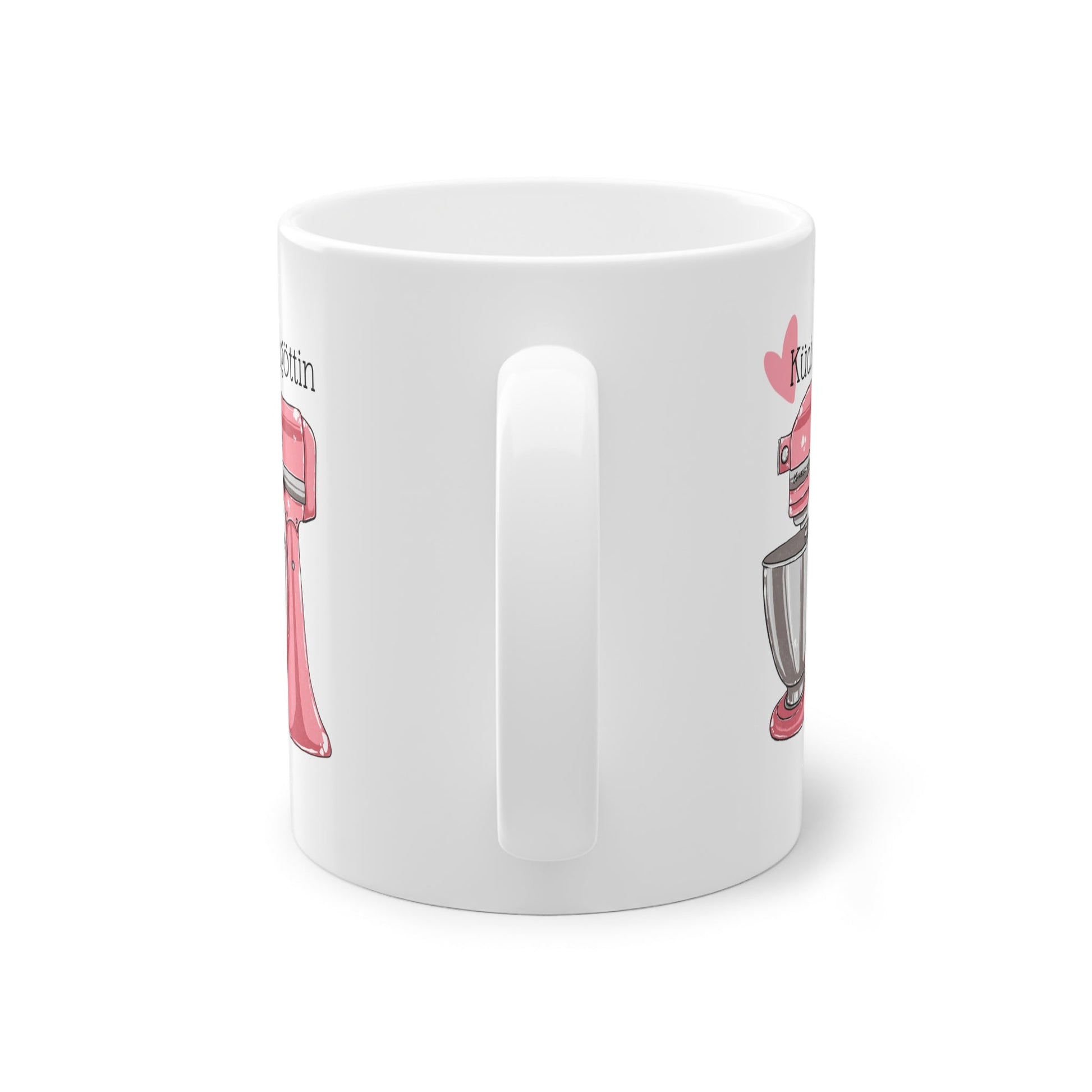 a white coffee mug with a pink handle