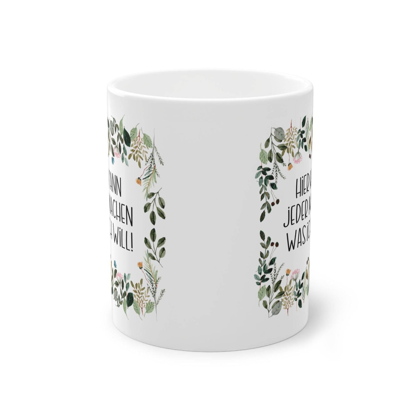 a white coffee mug with a floral design on it