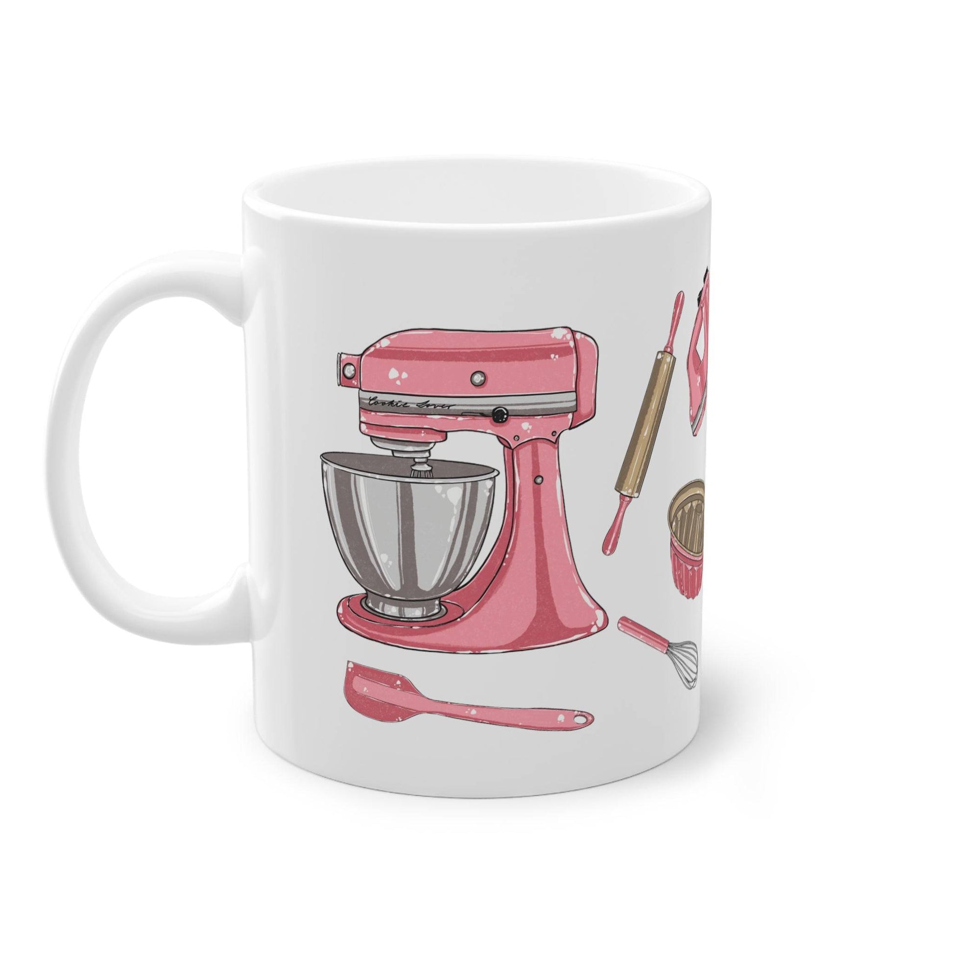 a coffee mug with a pink mixer on it