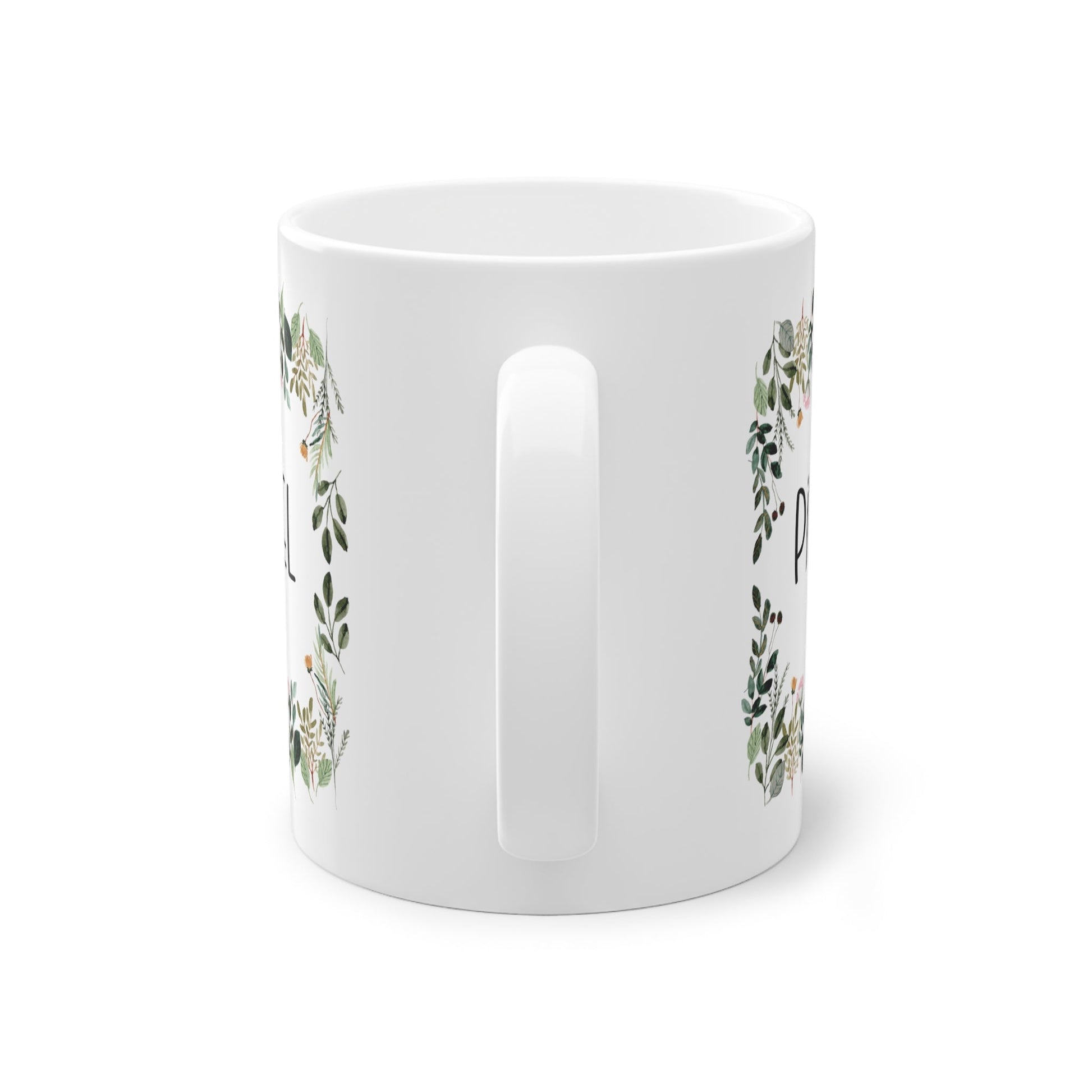 a white mug with a floral design on it