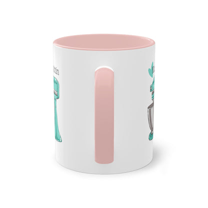 a white and pink coffee mug with a pink handle