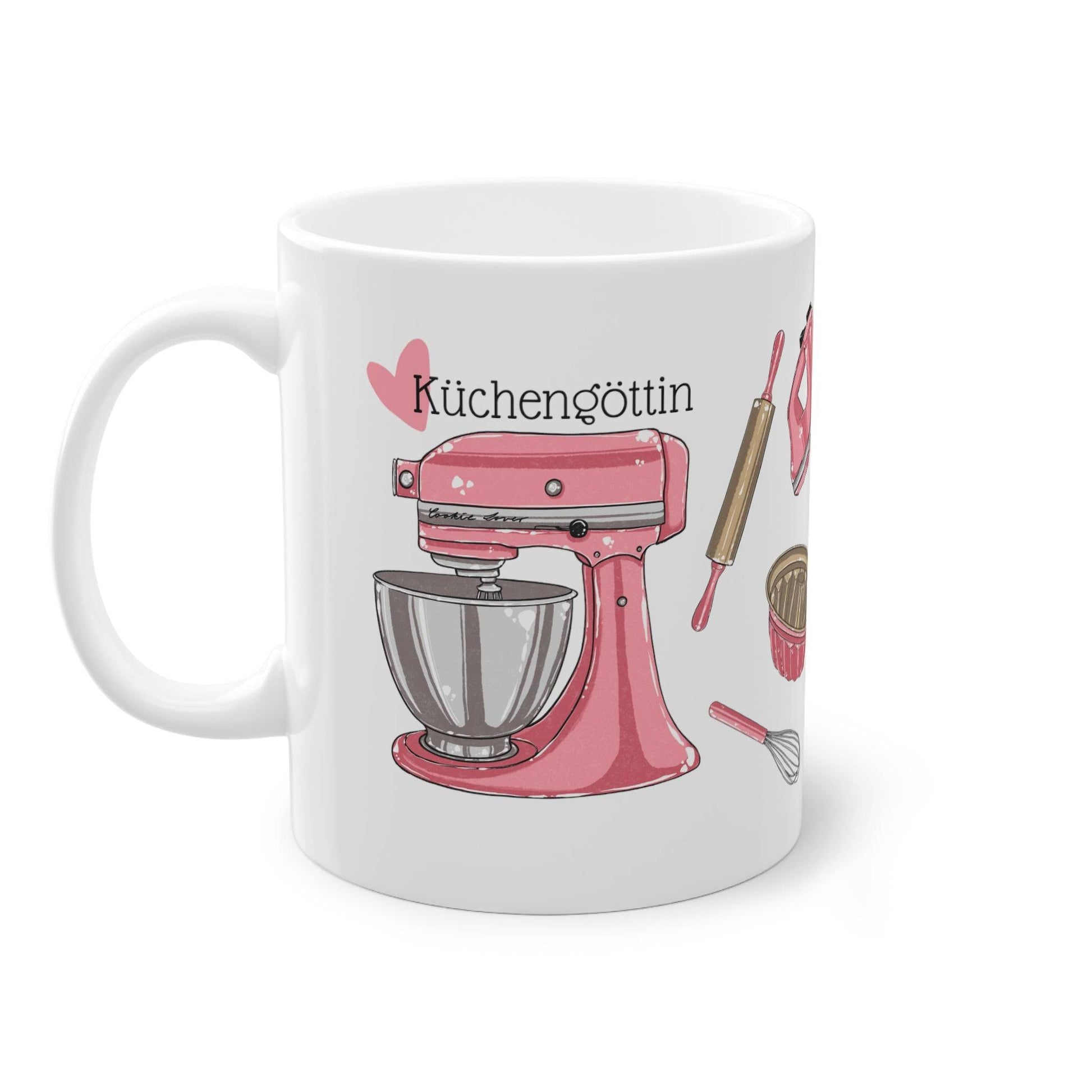 a coffee mug with a pink mixer on it