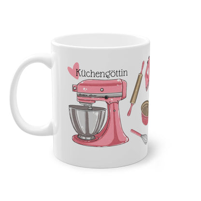 a coffee mug with a pink mixer on it