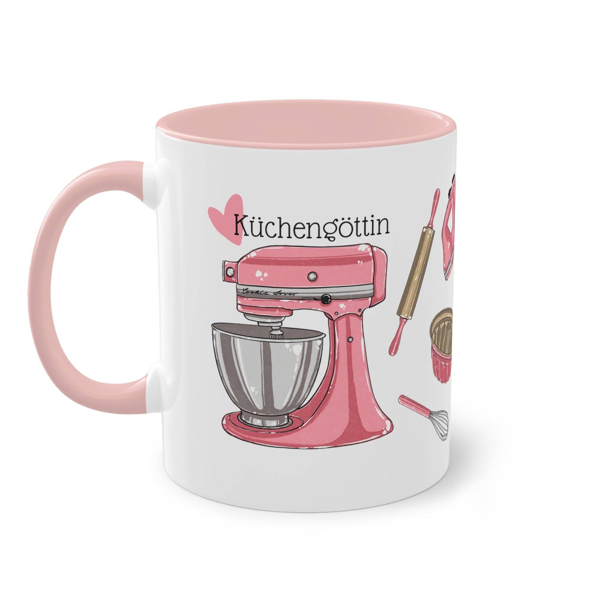 a coffee mug with a pink mixer on it