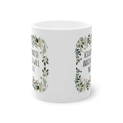 a white mug with a floral design on it